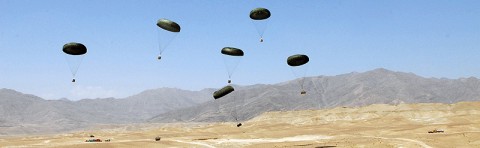 Resupply pallets parachute their way down to the ground during a resupply air drop mission at Forward Operating Base Gamberi, July 10th. The air drop was used to resupply the base as well as train the Afghan National Army soldiers on how to coordinate and conduct an air drop.