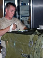 U.S. Army Spc. James Munns, 11th Quartermaster Company air drop specalist and Little Rock, AR, native, prepares a resupply pallet, July 8th, to be dropped at Forward Operating Base Gamberi on July 10th. 