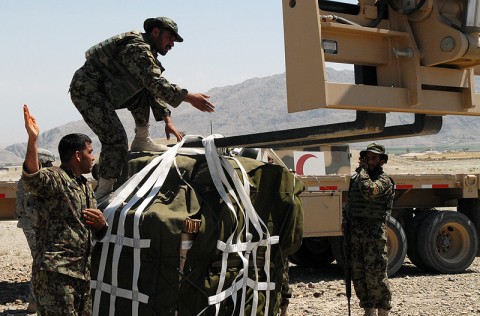 Afghan National Army soldiers from the 201st Flood Corps work together to attach a resupply pallet to a forklift duringa resupply air drop mission at Forward Operating Base Gamberi, July 10. The air drop was used to resupply the base as well as traing the ANA soldiers on how to coordinate and conduct an air drop.