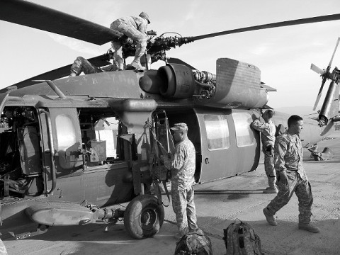 U.S. Army Spc. Phillip McRae from Livonia, MI, Spc. Thomas Schwaab from Leroy, NY, and Staff Sgt. Shaun Kirby from San Antonio, all with Company A, “Spiders” (4th Battalion, 3rd Aviation Regiment), 1st Battalion, 3rd Aviation Regiment, Task Force Viper, conduct a preventive maintenance daily inspection on an aircraft at Forward Operating Base Salerno May 2 after completing a mission. (Photo by U.S. Army Chief Warrant Officer 2 Jim Layne, Task Force Viper, 3rd Combat Aviation Brigade, TF Falcon)