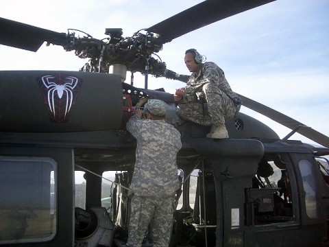 U.S. Army Chief Warrant Officer 3 Ed Griffie from Amite, LA, and Chief Warrant Officer 3 Greg Alford from Houston, both with Company A, “Spiders” (4th Battalion, 3rd Aviation Regiment), 1st Battalion, 3rd Aviation Regiment, Task Force Viper, prepare to conduct a high speed shaft vibration check on a Black Hawk engine following 120-hour maintenance at Forward Operating Base Salerno May 2nd. (Photo by U.S. Army Chief Warrant Officer 2 Jim Layne, Task Force Viper, 3rd Combat Aviation Brigade, TF Falcon)2