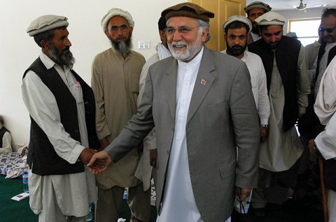 Fazlulah Wahidi, Kunar provincial governor, greets the elders at the Marawara district center. He joined Meshrano Jirga member Rafiullah Haideri, District Sub-governor Sayed Mehboob Pacha, and numerous provincial-level and district-level government officials at the event.  (Photo by U.S. Air Force 1st Lt. Amy Abbott, Kunar Provincial Reconstruction Team)