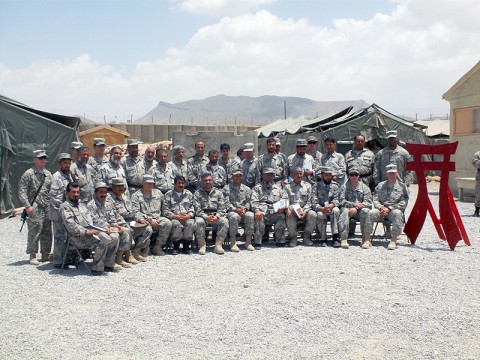 Afghan Border Police with their U.S. mentors take a break from a recent commander's conference to take a group photo at Camp Ghardez.