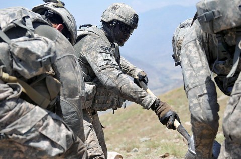 U.S. Army Staff Sgt. Orentheous. O. Reed of Blakely, CA, a squad leader with 1st Squad, 2nd Platoon, 2nd Battalion, 327th Infantry Regiment, Task Force No Slack, fills sandbags with his Soldiers in an effort to improve their fighting position at Combat Outpost Thomas. (Photo by U.S. Army Spc. Albert L. Kelley, 300th Mobile Public Affairs Detachment)