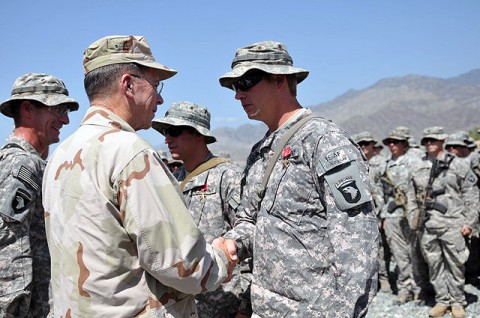 Chairman of the Joint Chiefs of Staff, U.S. Navy Adm. Michael G. Mullen, congratulates U.S. Army Sgt. Randy A. Sellers, of Pocatello, Idaho, for being awarded a Bronze Star with valor. Sellers was awarded a bronze star for assisting a company pinned down by enemy machine gun and small arms fire with no regard to his personal safety. Sellers also rendered aid to a Soldier who was wounded in action during the ordeal. (Photo by U.S. Army Spc. Albert L. Kelley, 300th Mobile Public Affairs Detachment)