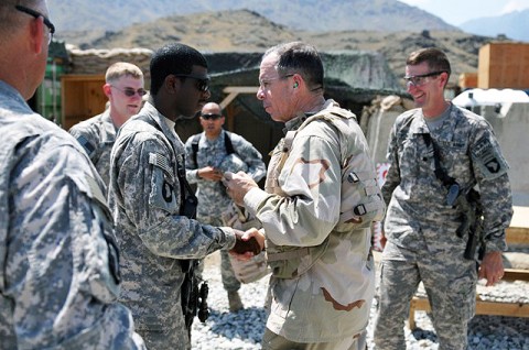 Chairman of the Joint Chiefs of Staff, U.S. Navy Adm. Michael G. Mullen gives a commanders coin to U.S. Army Spc. Jerome S. Talley, of Montgomery, AL. The admiral commended Soldiers of Task Force No Slack on their work and reminded them of the importance of the mission they are performing. (Photo by U.S. Army Spc. Albert L. Kelley, 300th Mobile Public Affairs Detachment)