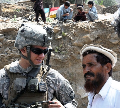 U.S. Army Sgt. 1st Lt. Ryker R. Sentgeorge of Astoria,OR, the platoon leader for 4th Platoon, Company D, 1st Battalion, 327th Infantry Regiment, Task Force Bulldog, talks with an elder hereJuly 20th. (Photo by U.S. Army Staff Sgt. Gary A. Witte, 300thMobile Public Affairs Detachment)