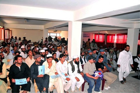 Local building contractors (left) discuss their companies, current projects, and what they look for in prospective employees at a job fair here July 5.  The Paktika Provincial Reconstruction Team hosted the job fair, which immediately followed the Vertical Engineering Skills Development Workshop graduation ceremony for 146 local students. The course provides basic construction and engineering skills. (U.S. Army courtesy photo)