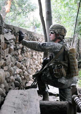 U.S. Army Sgt. Kyle A. Petry of West Manchester, Ohio, a squad leader for 2nd Platoon, Company D, 1st Battalion, 327th Infantry Regiment, Task Force Bulldog, helps provide security for a July 14th meeting with the village of Shamun in eastern Afghanistan’s Kunar province.(Photo by U.S. Army Staff Sgt. Gary A. Witte, 300th Mobile Public Affairs Detachment)