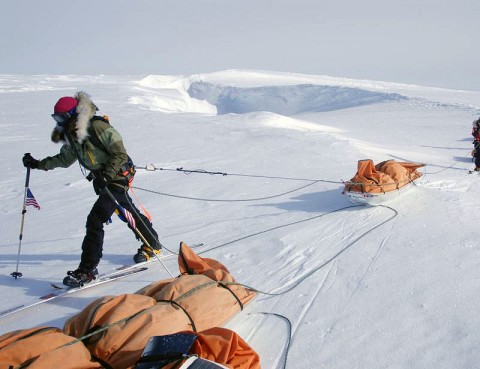 Alison Levine completes her 38-day arduous South Pole trek by skiing 10 hours a day in sub-zero temperatures with a sled containing 150lbs of gear and supplies harnessed to her waist.