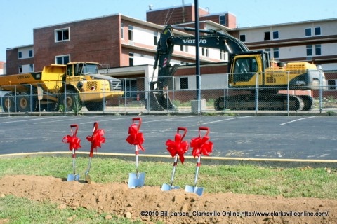 The recently broken ground with the hospital building in the background