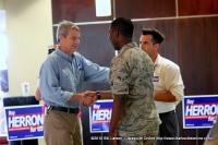 Roy Herron meeting an enlisted person before the event