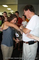 One of the 281 Students who passed the Advanced Placement Test draws her key(s) from the jar held by Director of Schools Mike Harris