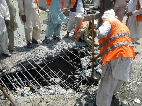 Afghan workers remove damaged concrete from Jalalabad’s Behsood Bridge in eastern Afghanistan’s Nangarhar province July 26th. The repair was fully funded by the Afghan government and completed by Afghan workers. (Photo by Jewell Bealmear, Nangarhar Provincial Reconstruction Team engineer)