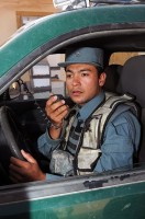 Asad, who uses one name, the team leader for the Afghan Uniform Police's Paktika Provincial Reconstruction Team detachment located on Forward Operating Base Sharana, practices radio standard operating procedures.(Photo by U.S. Air Force Master Sgt. Demetrius Lester)