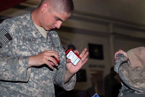 U.S. Army Pfc. Peter Lessard, 342nd Military Police Company customs agent and Concord, NH, native, inspects the contents of a redeploying Airman’s baggage at the Bagram Airfield’s customs terminal August 2nd. Every bag is thoroughly inspected for unauthorized items before it is allowed to leave Afghanistan. (Photo by U.S. Army Spc. Jay Venturini, 304th Public Affairs Detachment)