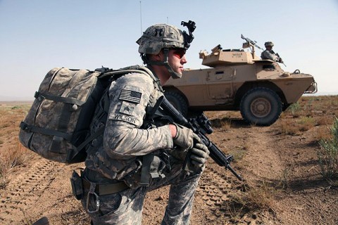 U.S. Army 2nd Lieutenant Phillip Divinski of Charlie Company, 3rd Battalion, 187th Infantry Regiment, 3rd Brigade, 101st Airborne Division, points to the next objective during a mission. (Photo by U.S. Army Sgt. Jeffrey Alexander/released)