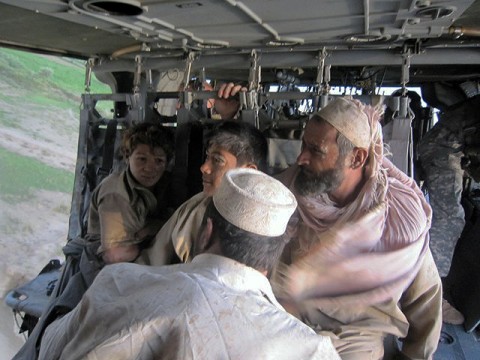 Afghans being evacuated after being rescued from flood waters. (Photo By U.S. Army Staff Sgt. Sean Wright_