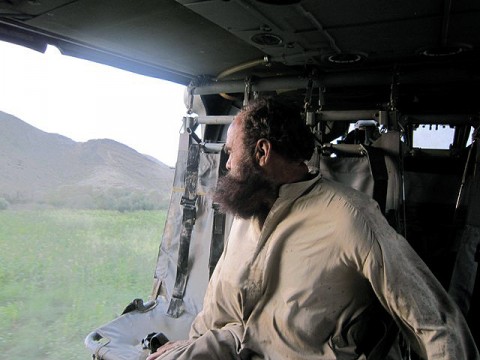 Afghan man looking out of helicopter (Photo by U.S. Army Staff Sgt. Sean Wright, Task force Red Knight)