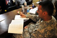 U.S. Army Spc. Murod Fa Hokkov of Queens, NY, Headquarters and Headquarters Troop, 3rd battalion, 17th Cavalry Regiment, Task Force Lighthorse, reads a criminal justice text book at Forward Operating Base Fenty here August 10th. Even while deployed, Soldiers continue to pursue their education. (Photo by U.S. Army Spc. Richard Daniels Jr., Task Force Bastogne Public Affairs)