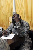 U.S. Staff Sgt. Kendricks Fields of Fork, SC, Task Force Lighthorse Chemical, Biological, Radiological, Nuclear and High Yield Explosives noncommissioned officer in charge, takes a criminal justice course test at Forward Operating Base Fenty August 10th. (Photo by U.S. Army Spc. Richard Daniels Jr., Task Force Bastogne Public Affairs)