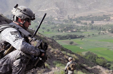 U.S. Army 1st Lt. David T. Broyles of Hilliard, OH, the platoon leader for 1st Platoon, Company A, 1st Battalion, 327th Infantry Regiment, Task Force Bulldog, watches as his men leave Observation Post Rocky here with Afghan National Army Soldiers July 19th. (Photo by U.S. Army Staff Sgt. Gary A. Witte, 300th Mobile Public Affairs Detachment)