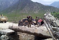 The 2nd Brigade, 201st Corps Afghan National Army Engineers replaces a cement slab on the Dab Bridge August 8th in eastern Afghanistan’s Kunar province. The bridge was damaged during a flood and limited military and civilian transportation. (Photo by U.S. Army Staff Sgt. Thomas White, Task Force Bastogne)