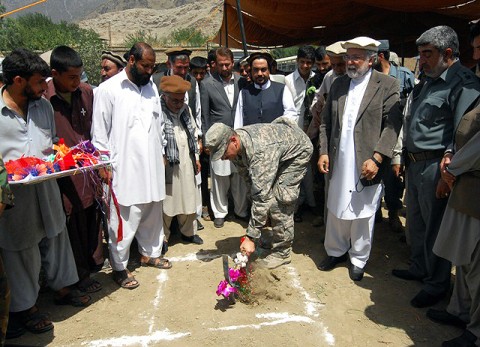 U.S. Navy Lt. Cmdr. Paul Wewers, stationed at Tinker Air Force Base, OK, Kunar PRT executive officer, participates in the ground breaking ceremony for the Asadabad orphanage July 15th. (Photo by U.S. Air Force 1st Lt. Amy Abbott, Kunar Provincial Reconstruction Team)