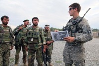 U.S. Army 2nd Lt. Charles Evans, platoon leader for Company C, 3rd Battalion, 187th Infantry Regiment, 101st Airborne Division from Fort Campbell, KY, gives a mission briefing to a group of Afghan National Army soldiers before a joint air-assault operation at the Tut Village in the Andar District of Ghazni Province August 8th. (Photo by U.S. Army Spc. Lorenzo D. Ware, 982nd Combat Camera Company)