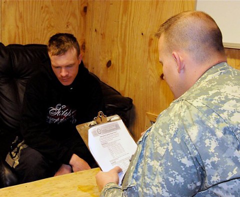 U.S. Army Sgt. Ryan M. Lahr (right), a native of Estherville, IA, and certified occupational therapy assistant, Mild Traumatic Brain Injury Clinic, 626th Brigade Support Battalion, 3rd Brigade, 101st Airborne Division, administers a cognitive memory test to U.S. Army Spc. Steven J. Smith. (Photo by U.S. Army Sgt. Brent C. Powell, 3rd Brigade, 101st Airborne Division)