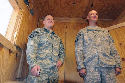 U.S. Army Sgt. Ryan M. Lahr (left), uses a Wii game system to administer balance exercises to U.S. Army Sgt. 1st Class James R. Jones, native of Woodlawn, TN, and platoon sergeant for 1st Platoon, Troop B, 133rd Calvary Regiment.  Jones was recently involved in an insurgent attack and had a rocket-propelled grenade explode in the air just a few feet from him, knocking him unconscious.  (Photo by U.S. Army Sgt. Brent C. Powell, 3rd Brigade, 101st Airborne Division)