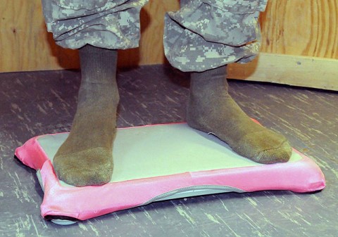 U.S. Army Sgt. 1st Class James R. Jones, native of Woodlawn, TN, and platoon sergeant for 1st Platoon, Troop B, 133rd Calvary Regiment uses a Wii game system’s balance board to perform balance exercises at the Mild Traumatic Brain Injury Clinic at Camp Sharana. (Photo by U.S. Army Sgt. Brent C. Powell, 3rd Brigade, 101st Airborne Division)