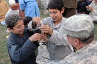 Nangahar Province, Afghanistan – Afghan youths demonstrate the knot they learned during his scout troop's April 24 meeting at Forward Operating Base Finley-Shields. The troop aims to provide kids in the area with discipline and instruction. (Photo by U.S. Army Staff Sgt. Gary A. Witte, 300th Mobile Public Affairs Detachment)