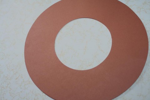 Start with a large circle cut out of brown paper