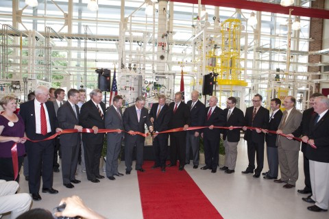 President Tim Hall and Hemlock Semiconductor CEO Rick Doornbros cut the ribbon while surrounded by area dignitaries along with other HSC officials (APSU)