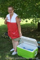 A Red Cross worker offers firefighters cold drinks