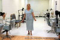 Linda Austin shows off her newly reconstructed Salon area at Austin’s Beauty School’s Grand reopening