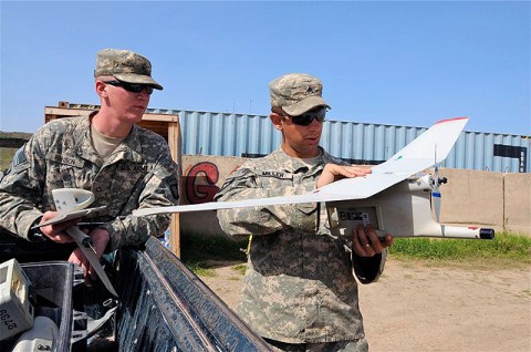 U.S. Army Sgt. Justin Miller attaches the wings to a Raven remotely piloted aircraft Sept. 14th as U.S. Army Pfc. Charles Hanson, rifleman, Co. A, 1st Bn., 187th Inf. Reg., a native of Spartanburg, SC, looks on. The Soldiers use the RPA to provide aerial surveillance and reconnaissance for the company commander when needed. (Photo by U.S. Army Sgt. Brent C. Powell, 3rd Brigade, 101st Airborne Division)