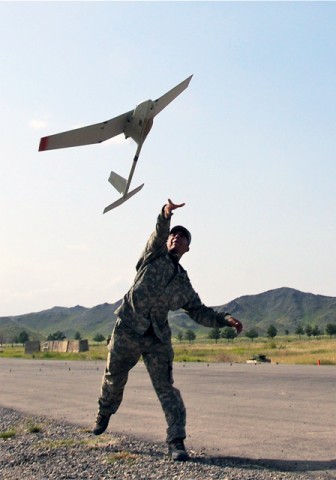 U.S. Army Spc. Marcos Nino, radio operator, Company A, 1st Battalion, 187th Infantry Regiment, from Dallas, launches a Raven remotely piloted aircraft on Forward Operating Base Salerno during a recent test flight Sept. 14th. The small RPA provides aerial battlefield surveillance and reconnaissance for the company commander. (Photo by U.S. Army Sgt. Brent C. Powell, 3rd Brigade, 101st Airborne Division)