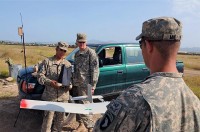 U.S. Army Spc. Marcos Nino (left), checks the controls of a Raven remotely piloted aircraft Sept. 14th as U.S. Army Pfc. Charles Hanson, rifleman and native of Spartanburg, S.C., Co. A, 1st Bn., 187th Inf. Reg., watches. The Soldiers, assigned to Task Force Leader, recently took the opportunity to conduct a test flight of the Raven on Forward Operating Base Salerno. (Photo by U.S. Army Sgt. Brent C. Powell, 3rd Brigade, 101st Airborne Division)