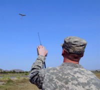 U.S. Army Pfc. Charles Hanson, rifleman and native of Spartanburg, SC, Company A, 1st Battalion, 187th Infantry Regiment, keeps an eye on a Raven remotely piloted aircraft during a recent test flight at Forward Operating Base Salerno Sept. 14th. The small RPA provides aerial battlefield surveillance and reconnaissance for the company commander. (Photo by U.S. Army Sgt. Brent C. Powell, 3rd Brigade, 101st Airborne Division)