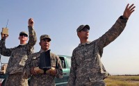 U.S. Army Spc. Marcos Nino (center), pilots the controls of a Raven remotely piloted aircraft Sept. 14th as U.S. Army Pfc. Charles Hanson (left), rifleman and native of Spartanburg, SC, Co. A, 1st Bn., 187th Inf. Reg., and U.S. Army Sgt. Justin Miller, native of West Palm Beach, FL, and infantry team leader, Co. A, 1st Bn., 187th Inf. Reg., keep an eye on the small aircraft during a recent test flight on Forward Operating Base Salerno. (Photo by U.S. Army Sgt. Brent C. Powell, 3rd Brigade, 101st Airborne Division)