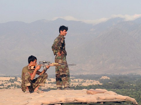 Afghan Soldiers with the 6th Kandak survey the territory around Combat Outpost Badel in eastern Afghanistan Aug. 23rd. International Security Assistance Forces with Task Force Bastogne are constantly working on ways to help improve the defenses of Afghan bases, observation posts and checkpoints. (Photo by U.S. Army Staff Sgt. Gary A. Witte, 300th Mobile Public Affairs Detachment)