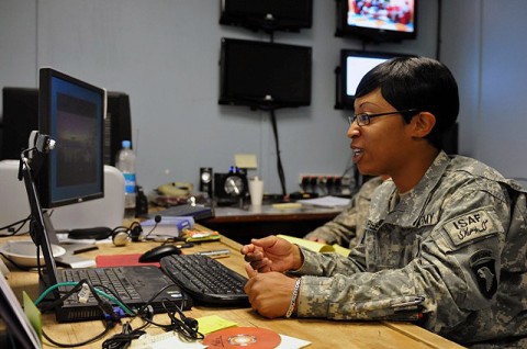 U.S. Army Sgt. Dianne T. Peele, of Portsmouth, VA, a human resources manager with Headquarters and Headquarters Company, 1st Brigade Combat Team, Task Force Bastogne, participates in an online chat session with a teenage female Afghan students in the city of Jalalabad in eastern Afghanistan’s Nangarhar Province Sept. 21st. (Photo by U.S. Army Sgt. Albert L. Kelley, 300th Mobile Public Affairs Detachment)