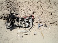 Remnants of a motorcycle remain after the armed driver tried to flee from Task Force Iron Rakkasan Soldiers Sept. 27th. TF Iron was conducting a morning patrol and received small arms fire, prompting them to return fire. Two AH-64 Apache helicopters from TF Gambler identified the armed motorcyclist, and the pilots engaged the insurgent and two other armed men, killing all three and destroying their weapons and the motorcycle. (U.S. Army courtesy photo)