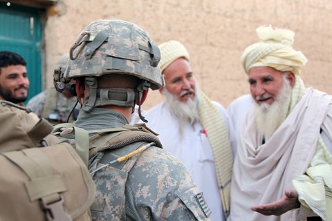 A paratrooper from Attack Company, 1st Battalion, 503rd Infantry Regiment, 173rd Airborne Brigade Combat Team speaks with village elders in Chak District, Wardak Province, during Operation Talon Purge Sept. 24th, the largest air assault operation the Sky Soldiers of the 173rd ABCT and their Afghan counterparts executed since their arrival in theater. (U.S. Army courtesy photo)