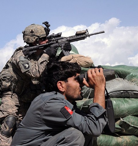 U.S. Army Pfc. Ryan L. Carson of Richmond, Va., a member of the Company Intelligence Support Team with Company A, 1st Battalion, 327th Infantry Regiment, Task Force Bulldog, and an Afghan National Police officer search the nearby hillside just prior to a more than three-hour firefight at the Shege East ANP checkpoint Sept. 18th. (Photo by U.S. Army Staff Sgt. Gary A. Witte, 300th Mobile Public Affairs Detachment) U.S. Army Pfc. Ryan L. Carson of Richmond, Va., a member of the Company Intelligence Support Team with Company A, 1st Battalion, 327th Infantry Regiment, Task Force Bulldog, and an Afghan National Police officer search the nearby hillside just prior to a more than three-hour firefight at the Shege East ANP checkpoint Sept. 18th. (Photo by U.S. Army Staff Sgt. Gary A. Witte, 300th Mobile Public Affairs Detachment)