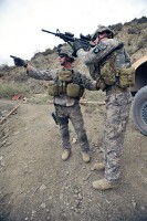 U.S. Army Spc. Jared Goodwin, a medic with Troop A, 1st Squadron, 33rd Cavalry Regiment, 3rd Brigade Combat Team, directs U.S. Army Pfc. Josh Lanehart, a driver with Troop A, 1st Squadron, 33rd Cavalry Regiment, 3rd BCT, to pull security toward high ground during dismounted operations. (Photo by U.S. Army Pfc. Chris McKenna, 3rd Brigade Combat Team Public Affairs)