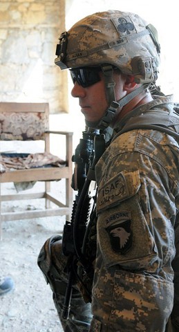 U.S. Army Staff Sgt. Tracey E. Allen of Russellville, OH, a squad leader with Company A, 2nd Battalion, 327th Infantry Regiment, Task Force No Slack, consults with his platoon leader about security during a visit to Lar Sholtan village in eastern Afghanistan's Kunar province Aug. 21st. (Photo by U.S. Army Staff Sgt. Gary A. Witte, 300th Mobile Public Affairs Detachment)