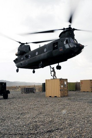 U.S. Army Pvt. Philip C. Brosch, 4th Brigade Combat Team, 101st Airborne Division, braces himself as he prepares to hook up a supply container to a CH-47 Chinook helicopter at Forward Operating Base Orgun-E Sept. 10th.(Photo by U.S. Army Spc. Luther L. Boothe Jr., Task Force Currahee Public Affairs, 4th Brigade Combat Team, 101st Airborne Division)